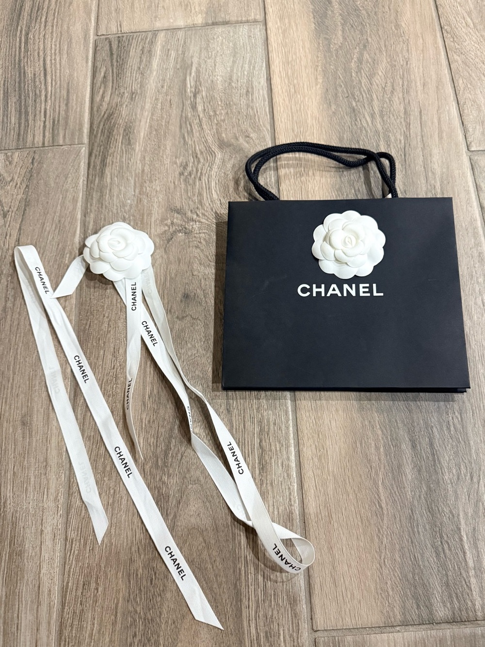 Chanel shopping bag and ribbon about 9x7 inches